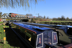 Narrowboats and train, river Great Ouse, Ely City