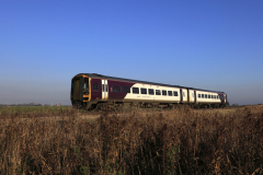 East Midlands train 158 774 passing Whittlesey town, Fenland, Cambridgeshire, England