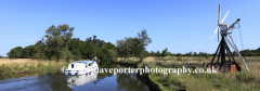 Boat on the river Ant passing How Hill Windpump