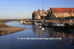 Sunset over Blakeney village Harbour