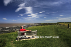 Walker on the coastal path, Bridgwater bay