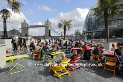 People on sun Loungers, South Bank river Thames
