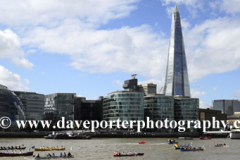 Rowing boats passing the Shard skyscraper