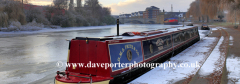 frozen river Nene and narrowboat, Peterborough