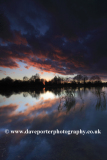 Autumn sunset over a Fenland waterway near Ely
