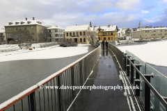 The frozen Tjornin lake and City Hall, Reykjavik