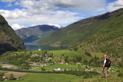 Walker looking at the town of Flam, Aurlandsfjorden