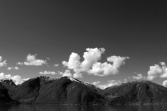 Reflections of mountains in Sognefjorden Fjord