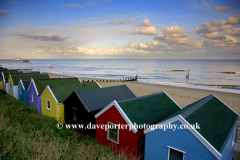 Sunset over beach huts at Southwold town