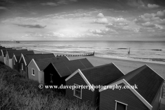 Sunset over beach huts at Southwold town