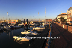 Dawn, boats and houses in Brighton Marina
