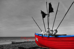 Red fishing boat on the beach, Worthing