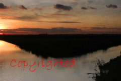 Sunset over a Fenland drain waterway near March