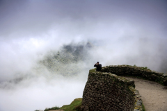 Tourist at Phuyupatamarca complex, Inca Trail, Peru