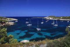 Tourist boats in the bay at Cala Xarraca, Ibiza